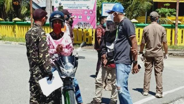 Dukung Perpanjangan PSBB, Banser Buol Bantu Tim Satgas Covid-19 di Pos Check Point