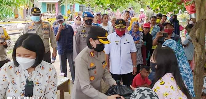 Polres Bolmong Berikan Bantuan Kepada Korban Kebakaran di Desa Doloduo