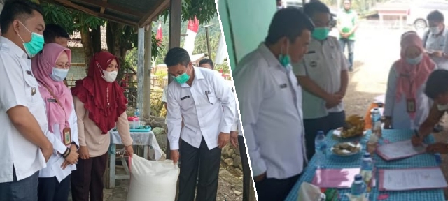 Sekda Bolmong Serahkan Bantuan Pengisian Lumbung Pangan Desa