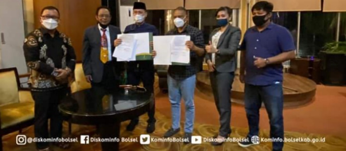 Iskandar Kamaru Taken MoU dengan Grand Q Hotel Gorontalo